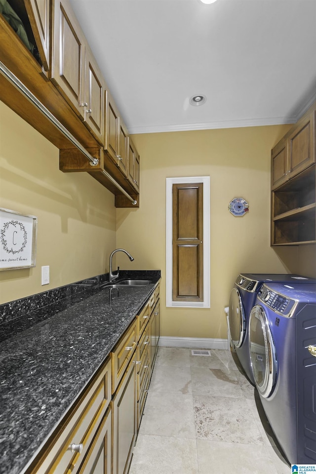 200 Asphodel Dr, Dothan, AL 36303 - laundry area featuring independent washer and dryer, crown molding, and cabinet space