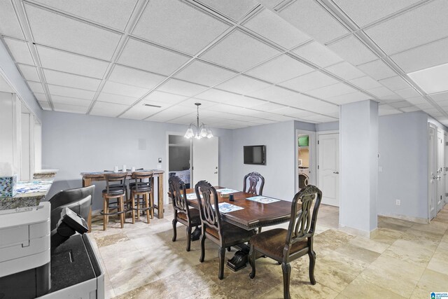 200 Asphodel Dr, Dothan, AL 36303 - dining room featuring washer / dryer, a drop ceiling, and a chandelier