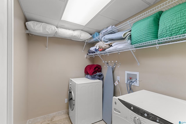200 Asphodel Dr, Dothan, AL 36303 - laundry room featuring washer and clothes dryer and light tile patterned floors