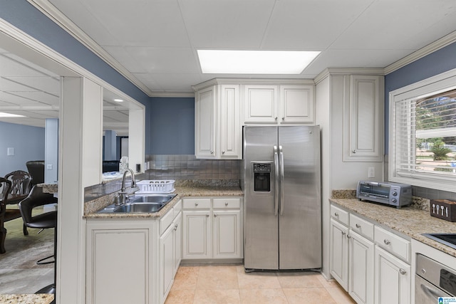 200 Asphodel Dr, Dothan, AL 36303 - kitchen with appliances with stainless steel finishes, a paneled ceiling, light tile patterned flooring, backsplash, and crown molding