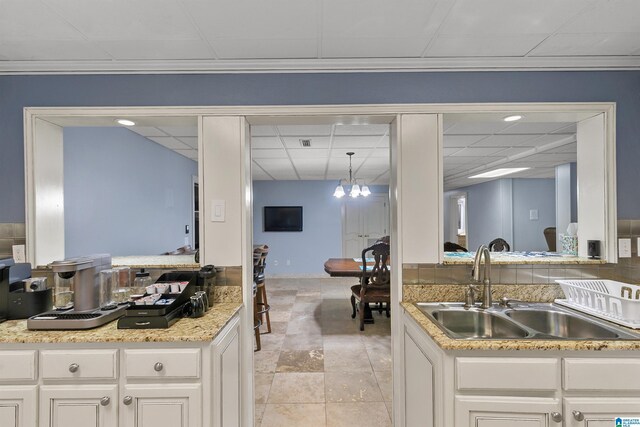 200 Asphodel Dr, Dothan, AL 36303 - kitchen with a drop ceiling, a chandelier, and white cabinetry