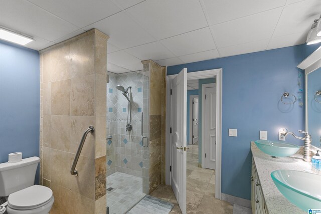 200 Asphodel Dr, Dothan, AL 36303 - bathroom featuring a shower stall, double vanity, and a paneled ceiling