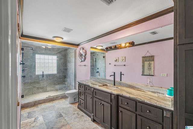 200 Asphodel Dr, Dothan, AL 36303 - bathroom with vanity, a shower stall, ornamental molding, and stone finish flooring