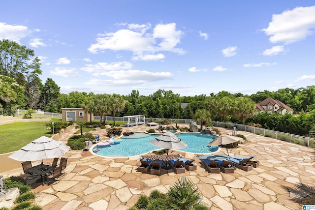 200 Asphodel Dr, Dothan, AL 36303 - view of swimming pool with a patio, view of scattered trees, and an outbuilding