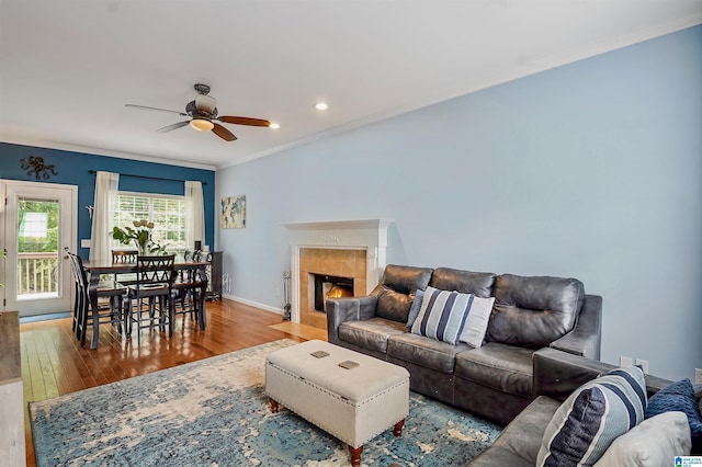 311 Hunter Hills Cir, Chelsea, AL 35043 - living room with crown molding, wood finished floors, ceiling fan, baseboards, and a fireplace