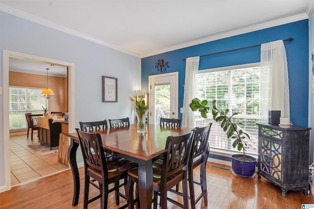 311 Hunter Hills Cir, Chelsea, AL 35043 - dining space with ornamental molding, plenty of natural light, wood finished floors, and baseboards