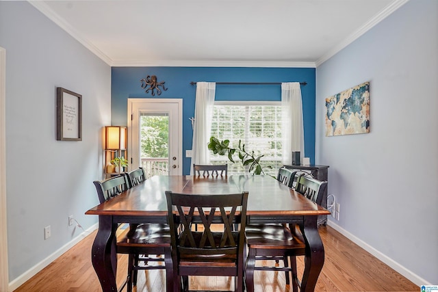 311 Hunter Hills Cir, Chelsea, AL 35043 - dining room with light wood finished floors, crown molding, and baseboards