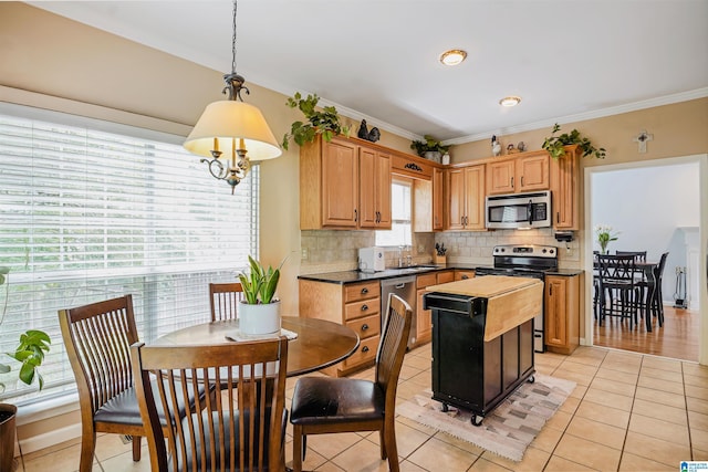 311 Hunter Hills Cir, Chelsea, AL 35043 - kitchen with appliances with stainless steel finishes, a sink, light tile patterned floors, decorative backsplash, and crown molding