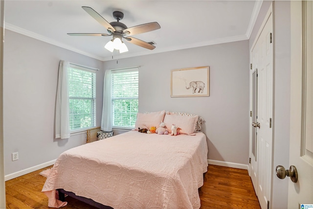 311 Hunter Hills Cir, Chelsea, AL 35043 - bedroom with wood finished floors, baseboards, crown molding, a closet, and ceiling fan