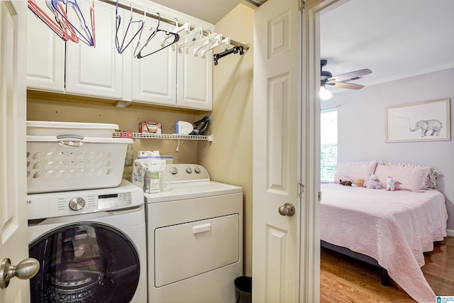 311 Hunter Hills Cir, Chelsea, AL 35043 - laundry room featuring cabinet space, washing machine and dryer, wood finished floors, and a ceiling fan