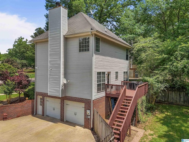 311 Hunter Hills Cir, Chelsea, AL 35043 - view of side of property with an attached garage, stairway, brick siding, and a wooden deck