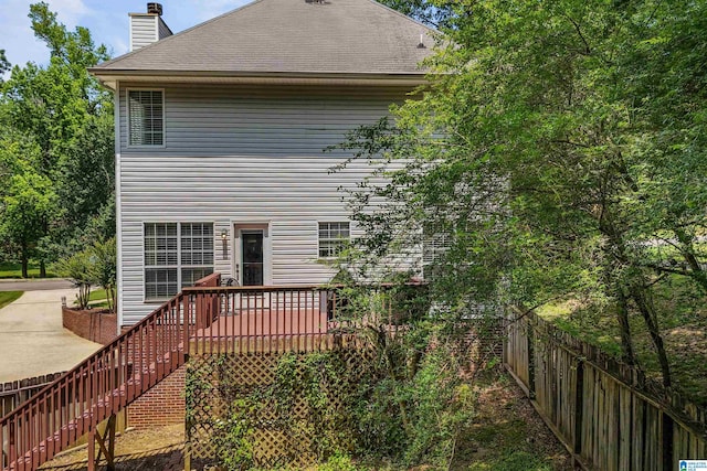 311 Hunter Hills Cir, Chelsea, AL 35043 - rear view of house with a chimney, stairway, a shingled roof, and a wooden deck