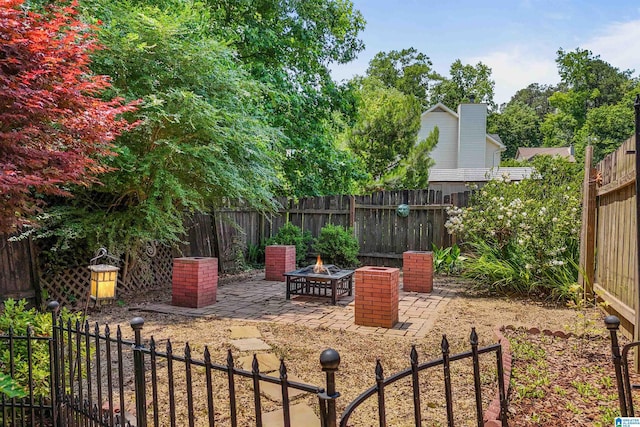 311 Hunter Hills Cir, Chelsea, AL 35043 - fenced backyard with an outdoor fire pit and a patio