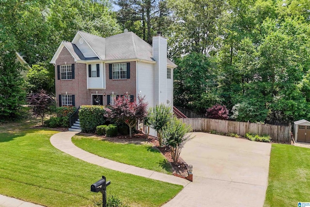 311 Hunter Hills Cir, Chelsea, AL 35043 - view of front facade featuring a chimney, driveway, and view of wooded area
