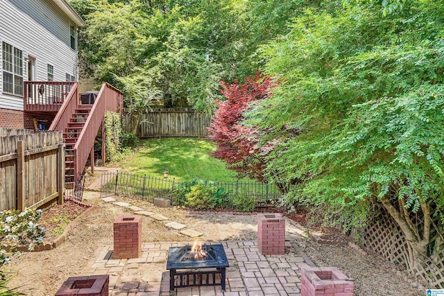 311 Hunter Hills Cir, Chelsea, AL 35043 - fenced backyard with an outdoor fire pit, a patio area, and stairway