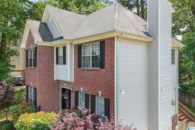 311 Hunter Hills Cir, Chelsea, AL 35043 - view of property exterior featuring a chimney, brick siding, and a shingled roof