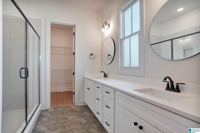 552 Village Green Way, Hoover, AL 35226 - bathroom with a stall shower, double vanity, and a walk in closet