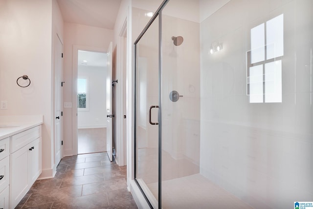 552 Village Green Way, Hoover, AL 35226 - bathroom featuring a stall shower, vanity, and baseboards