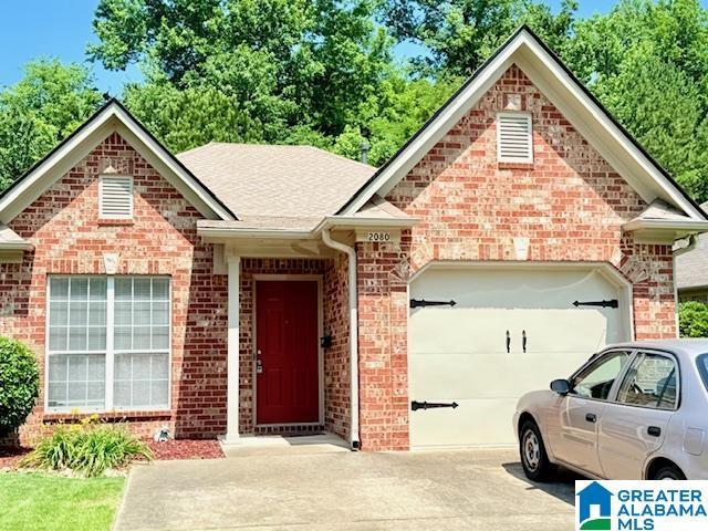 2080 Willow Glenn Dr, Birmingham, AL 35215 - ranch-style home with concrete driveway, brick siding, and a garage