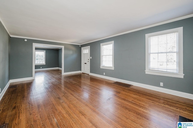 516 85th St, Birmingham, AL 35206 - unfurnished living room with ornamental molding, baseboards, and wood finished floors