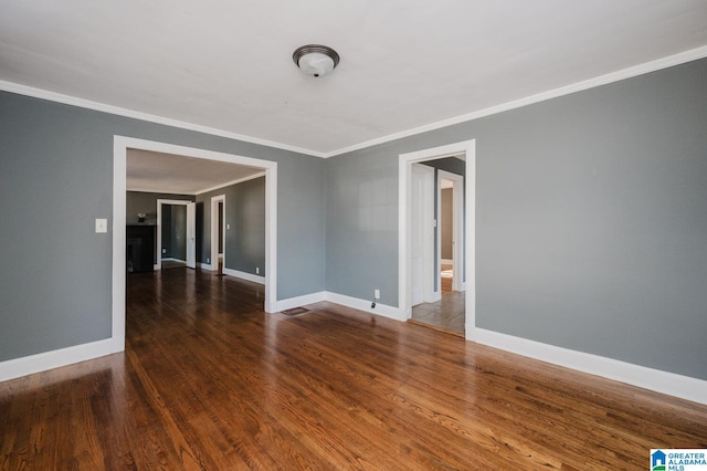 516 85th St, Birmingham, AL 35206 - empty room with crown molding, wood finished floors, and baseboards