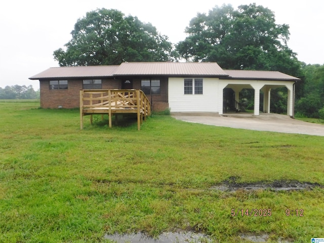 530 Sand Rock Ave, Leesburg, AL 35983 - rear view of house with a lawn, driveway, a deck, a carport, and metal roof