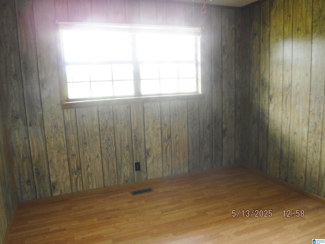 530 Sand Rock Ave, Leesburg, AL 35983 - empty room featuring wood finished floors, plenty of natural light, and wood walls