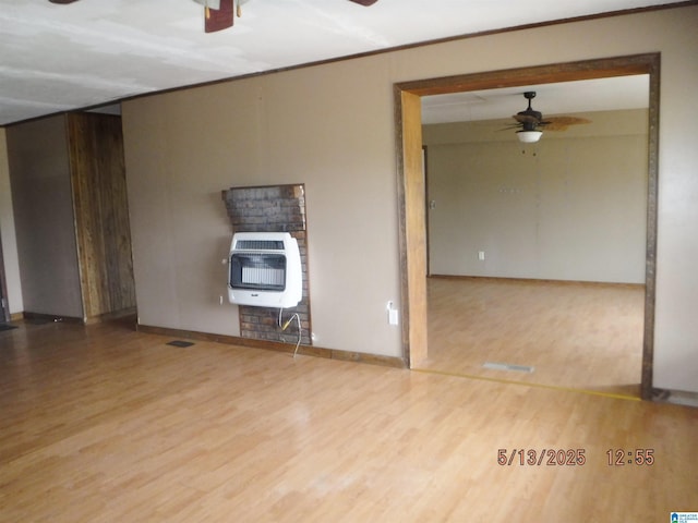 530 Sand Rock Ave, Leesburg, AL 35983 - unfurnished room featuring heating unit, a ceiling fan, wood finished floors, and crown molding