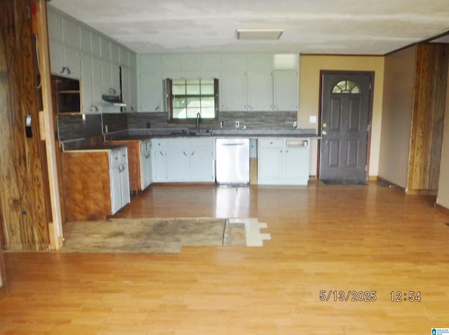 530 Sand Rock Ave, Leesburg, AL 35983 - kitchen featuring dishwashing machine, light wood-style flooring, under cabinet range hood, backsplash, and a sink