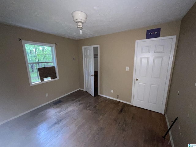 375 Little Dismal Rd, Arley, AL 35541 - unfurnished bedroom with wood finished floors and baseboards