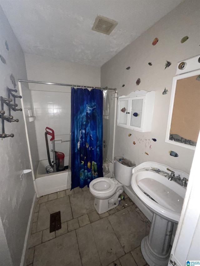 375 Little Dismal Rd, Arley, AL 35541 - full bath with shower / bath combination with curtain, toilet, tile patterned flooring, and a sink