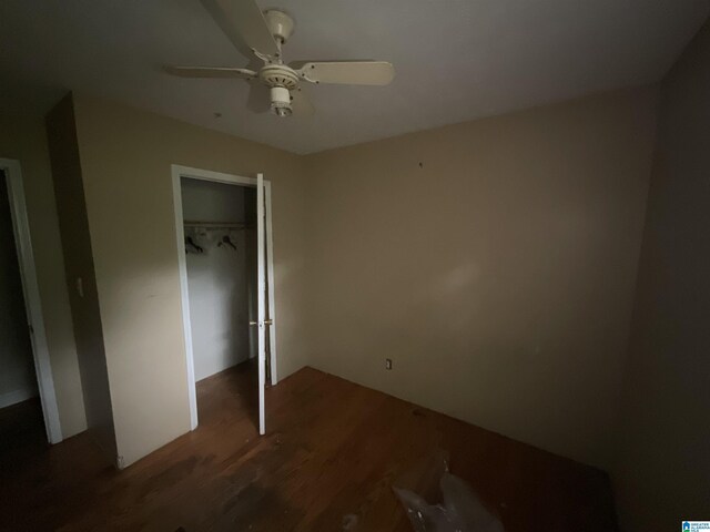 375 Little Dismal Rd, Arley, AL 35541 - unfurnished bedroom with wood finished floors, a closet, and ceiling fan