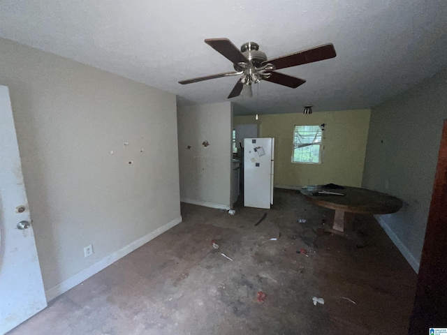 375 Little Dismal Rd, Arley, AL 35541 - unfurnished living room with a ceiling fan and baseboards
