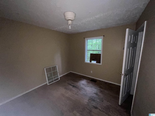 375 Little Dismal Rd, Arley, AL 35541 - empty room featuring baseboards and a textured ceiling