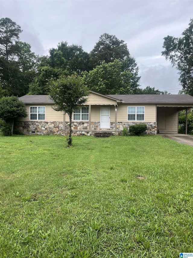 8 Fieldview Dr, Oneonta, AL 35121 - view of front facade with stone siding, an attached carport, a front lawn, and driveway