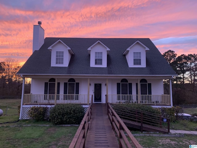 200 Shady Point Rd, Locust Fork, AL 35097 - cape cod-style house with covered porch, a chimney, roof with shingles, and a lawn