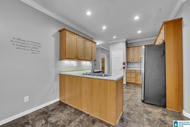 200 Shady Point Rd, Locust Fork, AL 35097 - kitchen featuring freestanding refrigerator, a peninsula, crown molding, recessed lighting, and a sink