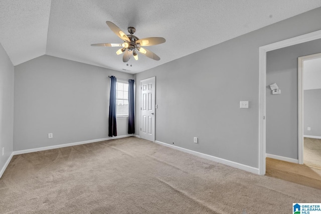 200 Shady Point Rd, Locust Fork, AL 35097 - empty room with carpet flooring, a ceiling fan, a textured ceiling, baseboards, and lofted ceiling