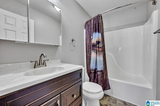 200 Shady Point Rd, Locust Fork, AL 35097 - bathroom featuring toilet, vanity, a textured ceiling, shower / bath combo with shower curtain, and stone finish floors