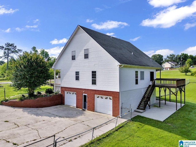 200 Shady Point Rd, Locust Fork, AL 35097 - view of side of home featuring stairs, a garage, concrete driveway, brick siding, and a wooden deck