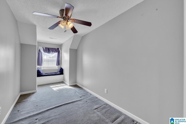 200 Shady Point Rd, Locust Fork, AL 35097 - additional living space with a textured ceiling, carpet flooring, baseboards, a ceiling fan, and lofted ceiling