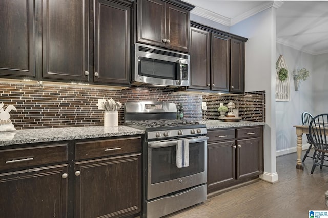 1037 Norman Way, Birmingham, AL 35242 - kitchen featuring appliances with stainless steel finishes, backsplash, crown molding, dark brown cabinets, and light stone countertops
