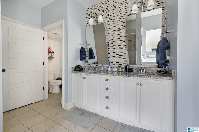 1037 Norman Way, Birmingham, AL 35242 - full bath with a stall shower, double vanity, tile patterned flooring, toilet, and baseboards
