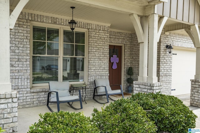 1037 Norman Way, Birmingham, AL 35242 - doorway to property with a porch, brick siding, and a garage