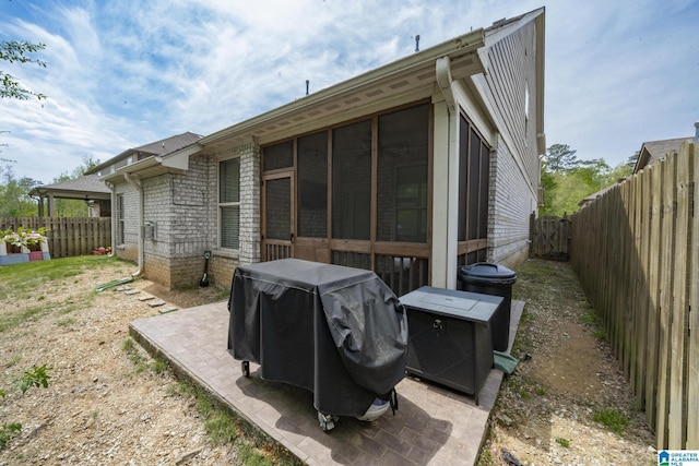 1037 Norman Way, Birmingham, AL 35242 - view of property exterior with a sunroom, a fenced backyard, a fire pit, and a patio