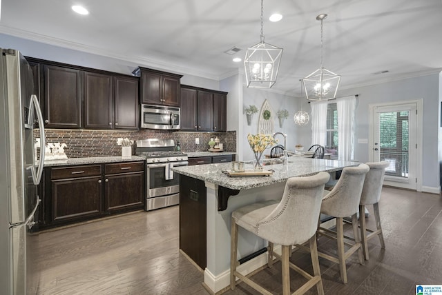 1037 Norman Way, Birmingham, AL 35242 - kitchen featuring stainless steel appliances, a kitchen breakfast bar, a chandelier, dark brown cabinets, and tasteful backsplash