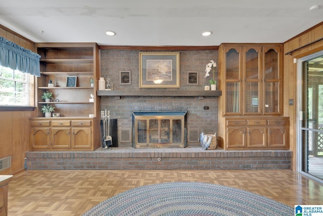 5420 Pine St, Sylvan Springs, AL 35118 - unfurnished living room featuring a brick fireplace, recessed lighting, and wood walls