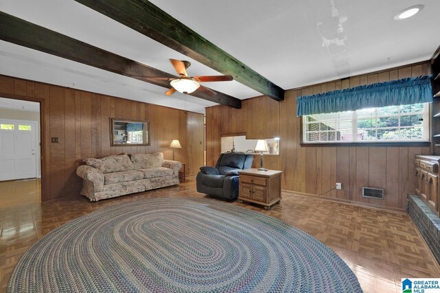 5420 Pine St, Sylvan Springs, AL 35118 - living area with wood walls, baseboards, beamed ceiling, and a ceiling fan