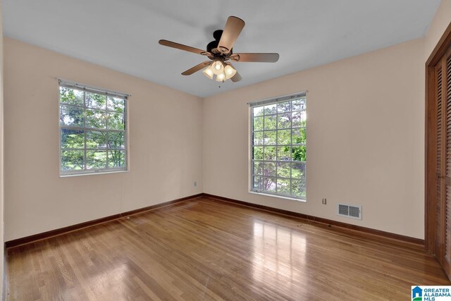 5420 Pine St, Sylvan Springs, AL 35118 - unfurnished room with plenty of natural light, wood finished floors, baseboards, and a ceiling fan