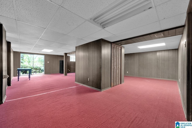 5420 Pine St, Sylvan Springs, AL 35118 - basement with a paneled ceiling, carpet floors, and wooden walls